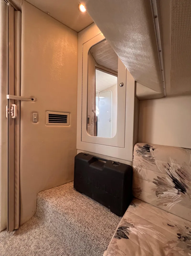 Slide: The Image of Interior of 2000 Wellcraft 45 Excalibur yacht with seating and mirror. - 35