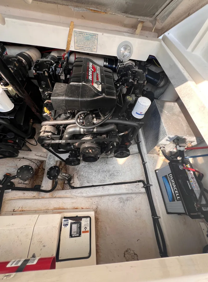 Slide: The Image of Engine compartment of 2000 Wellcraft 45 Excalibur boat, showcasing detailed mechanical components. - 43