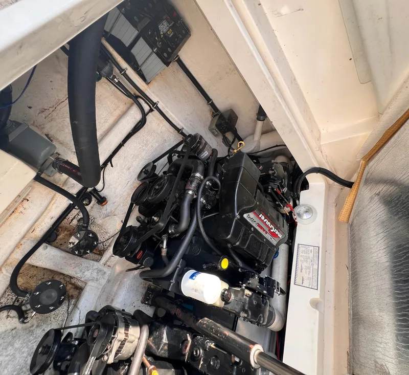 Slide: The Image of Engine compartment of 2000 Wellcraft 45 Excalibur boat, showcasing mechanical components. - 45