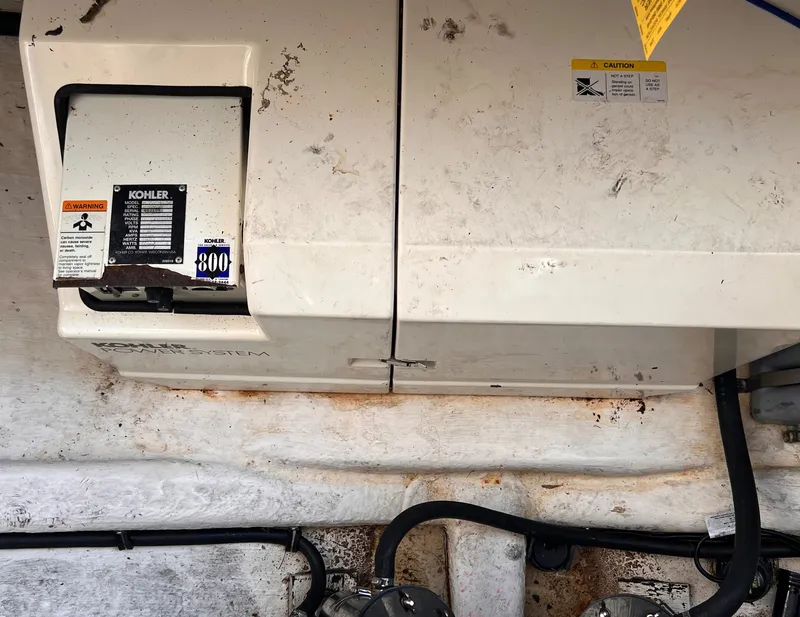 Slide: The Image of Kohler generator in 2000 Wellcraft 45 Excalibur engine compartment. - 46