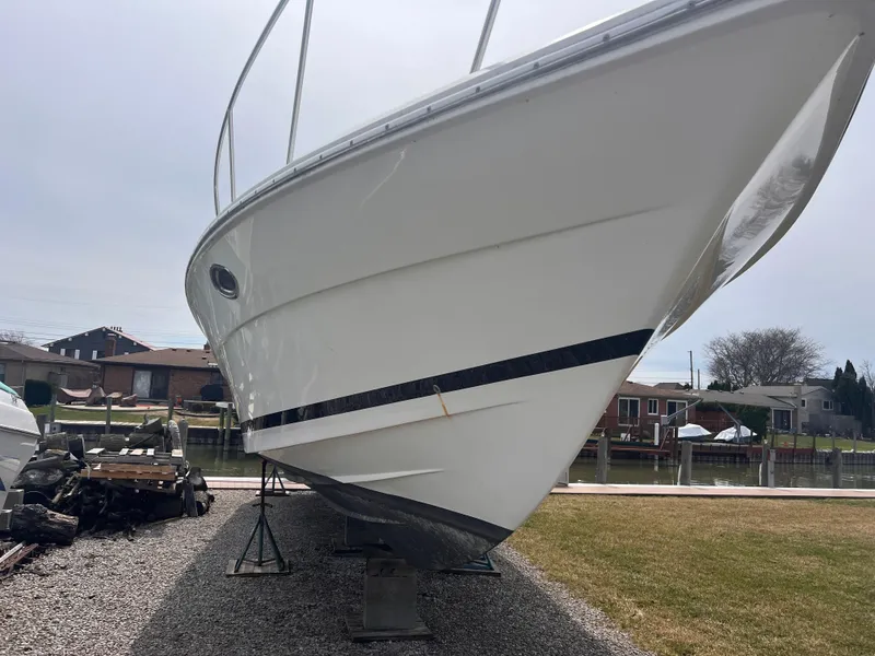 Slide: The Image of 2000 Wellcraft 45 Excalibur boat on dry dock, side view. - 48