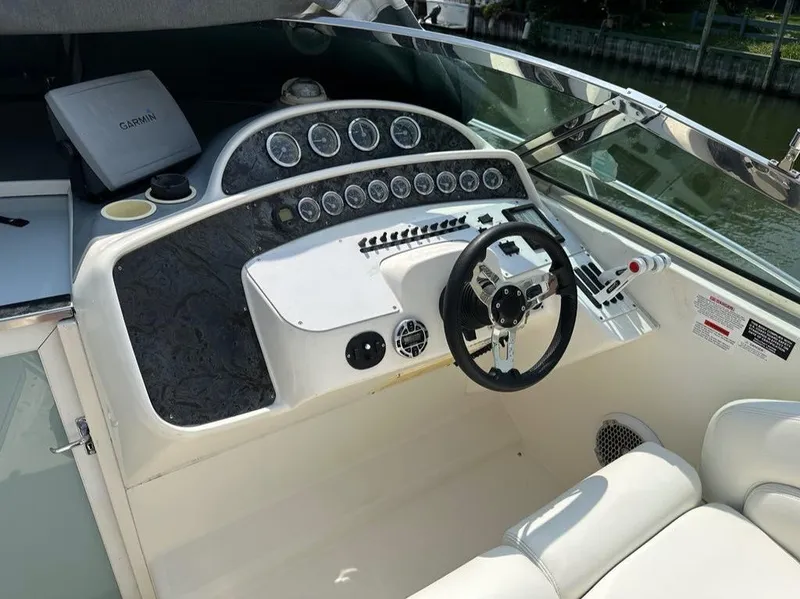Slide: The Image of 2000 Wellcraft 45 Excalibur boat dashboard with steering wheel and gauges. - 5