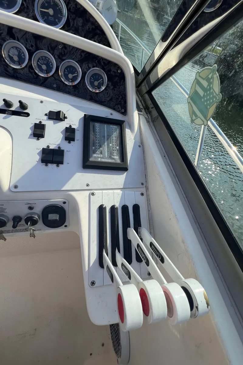 Slide: The Image of Control panel of 2000 Wellcraft 45 Excalibur boat with gauges and levers. - 6