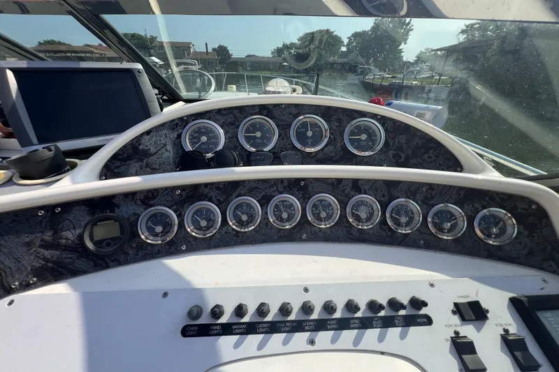 Slide: The Image of Dashboard of 2000 Wellcraft 45 Excalibur boat with gauges and controls. - 7