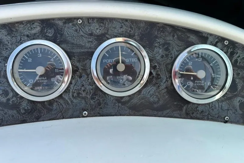 Slide: The Image of Dashboard gauges of a 2000 Wellcraft 45 Excalibur boat. - 8