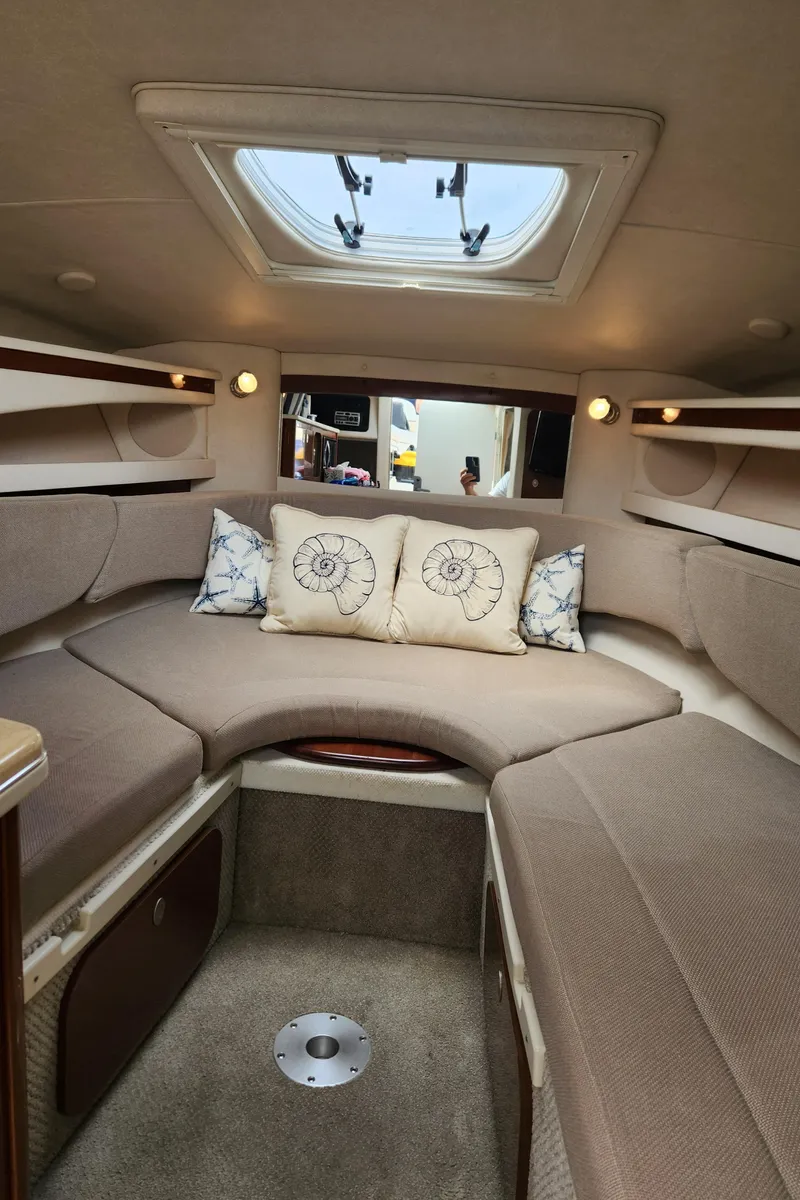 Slide: The Image of Interior of 2008 Sea Ray 260 Sundancer cabin with cozy seating and skylight. - 10