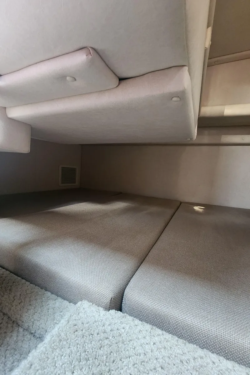 Slide: The Image of Interior cabin of 2008 Sea Ray 260 Sundancer with cushioned seating. - 19