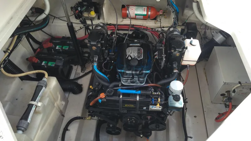 Slide: The Image of Engine compartment of 2008 Sea Ray 260 Sundancer boat, featuring detailed mechanical components. - 26