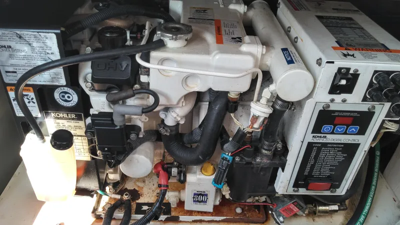 Slide: The Image of Engine compartment of a 2008 Sea Ray 260 Sundancer boat, featuring a Kohler generator. - 29