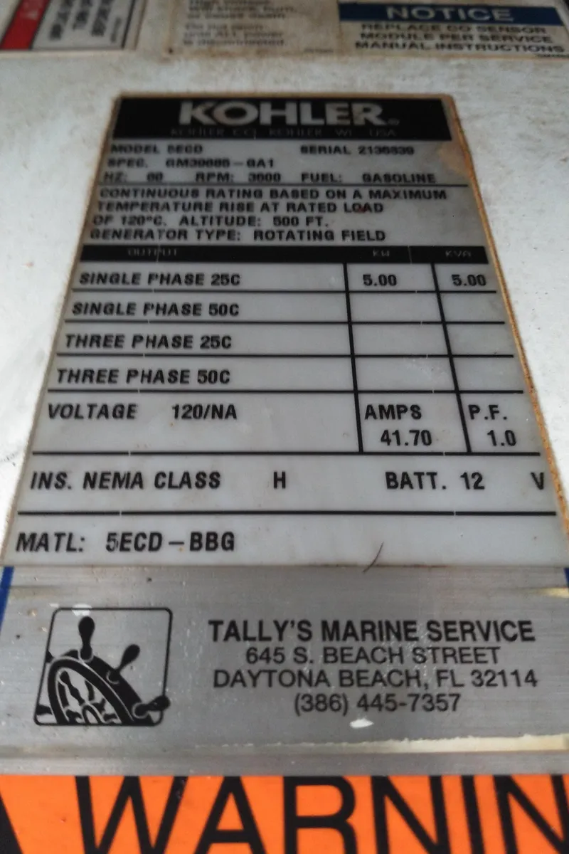 Slide: The Image of Kohler generator label on 2008 Sea Ray 260 Sundancer, Tally's Marine Service contact info. - 31