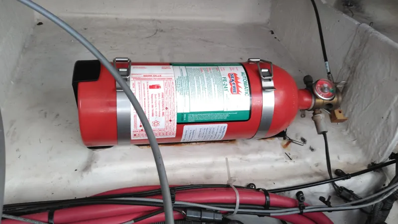 Slide: The Image of Fire extinguisher in 2008 Sea Ray 260 Sundancer boat compartment. - 36