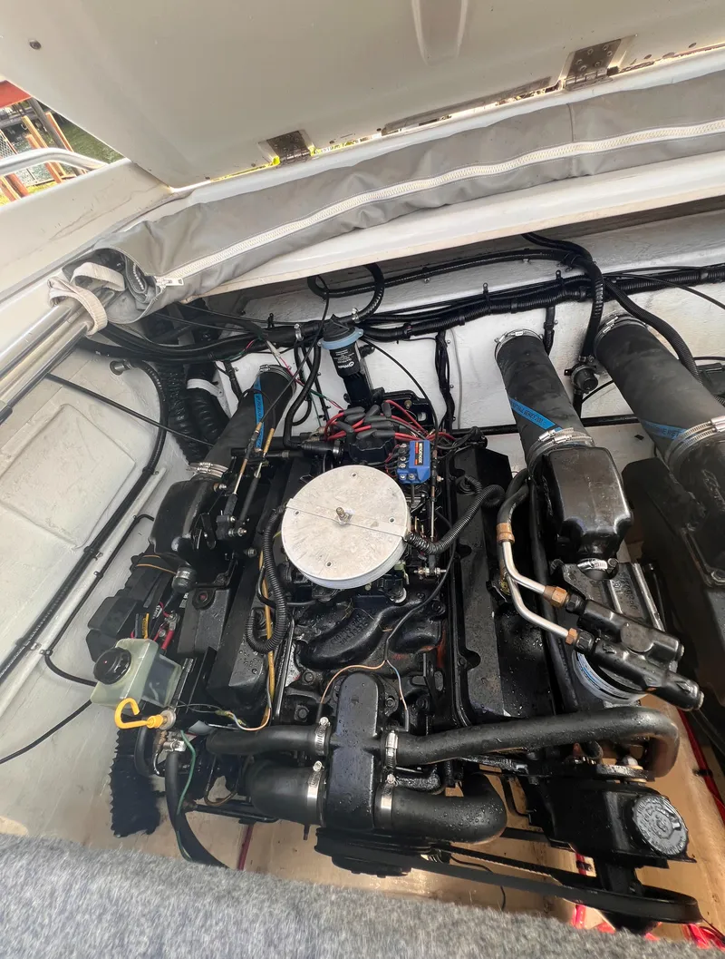 Slide: The Image of Engine compartment of a 1995 Powerquest 290 Enticer FX boat. - 15