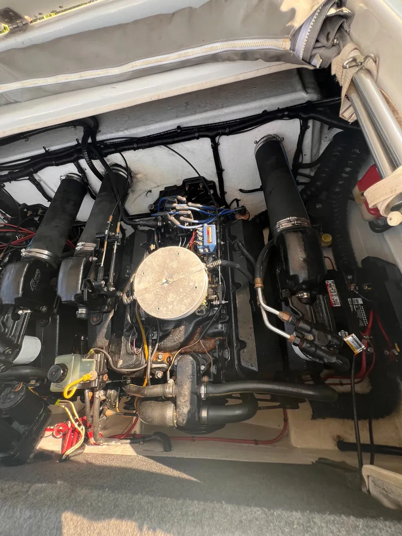 Slide: The Image of 1995 Powerquest 290 Enticer FX engine compartment with visible components and wiring. - 16