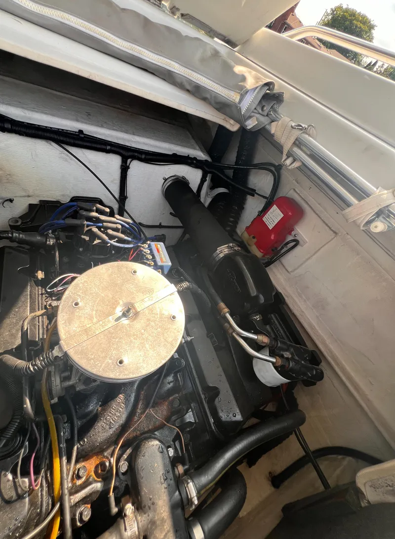 Slide: The Image of 1995 Powerquest 290 Enticer FX engine compartment with visible components and wiring. - 18