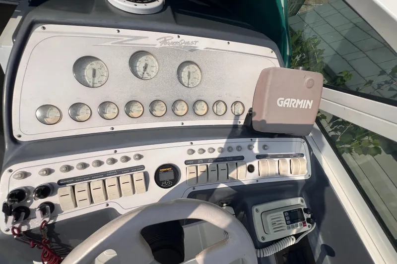 Slide: The Image of Dashboard of 1995 Powerquest 290 Enticer FX boat with Garmin navigation system. - 2