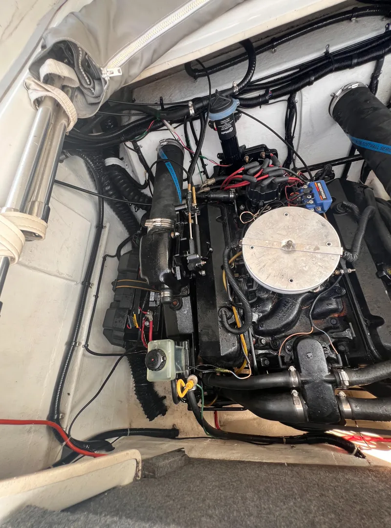 Slide: The Image of Engine compartment of 1995 Powerquest 290 Enticer FX boat, showcasing detailed wiring and components. - 20