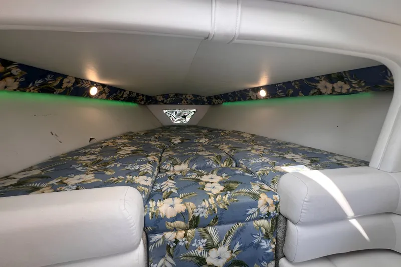 Slide: The Image of Interior of 1995 Powerquest 290 Enticer FX with floral-patterned bedding and white upholstery. - 9
