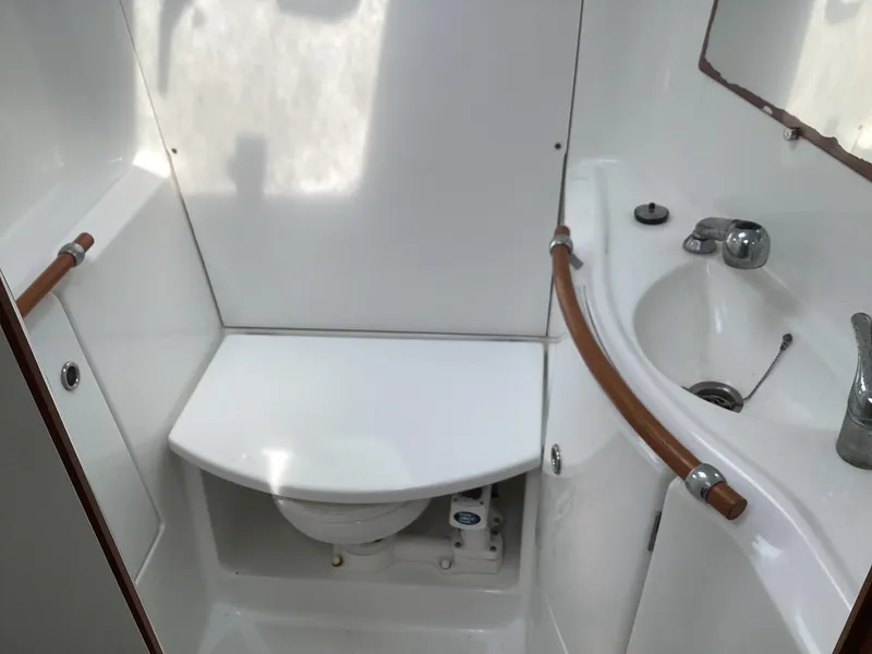 Slide: The Image of Beneteau 393 2002 yacht bathroom with sink and toilet. - 12