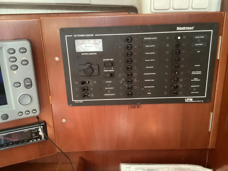 Slide: The Image of Beneteau 393 2002 yacht control panel with navigation and power systems. - 20