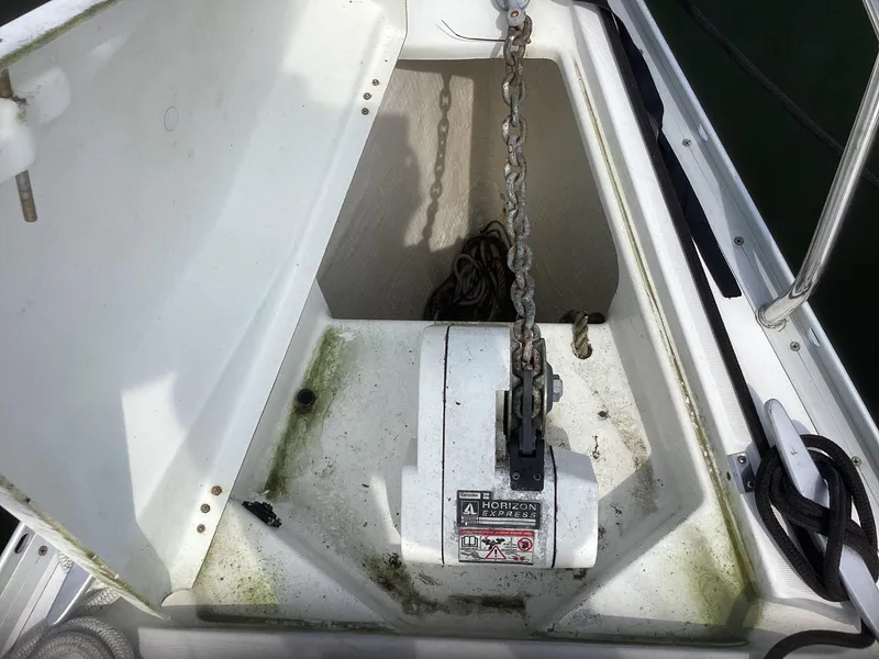 Slide: The Image of Anchor chain locker on 2002 Beneteau 393 sailboat, showing windlass and chain storage. - 26