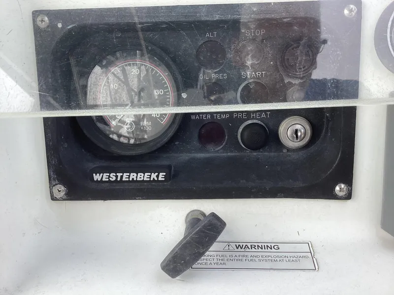 Slide: The Image of Control panel of a 2002 Beneteau 393 sailboat with Westerbeke engine gauges. - 35