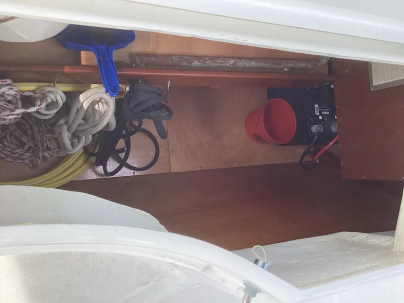 Slide: The Image of Storage compartment on a 2002 Beneteau 393 sailboat with ropes and equipment. - 37