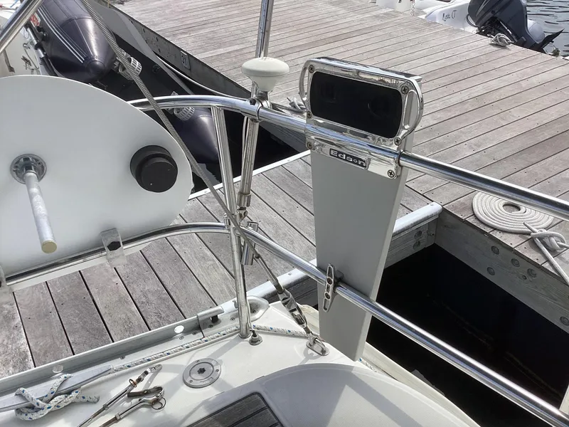 Slide: The Image of Beneteau 393 sailboat helm and deck details, docked at marina, 2002 model. - 38