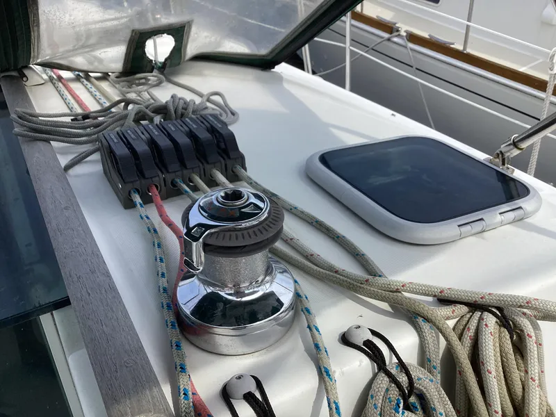 Slide: The Image of Close-up of Beneteau 393 sailboat deck winch and ropes, 2002 model. - 39