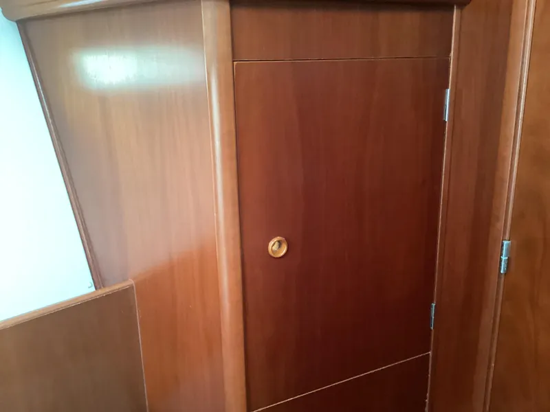 Slide: The Image of Wooden interior door on a 2002 Beneteau 393 sailboat. - 6