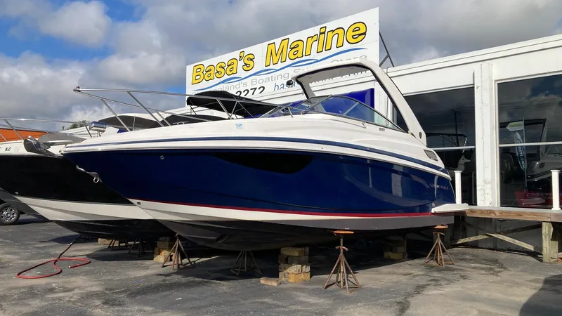 Slide: The Image of 2016 Regal 28 Express boat displayed at Basa's Marine dealership. - 0