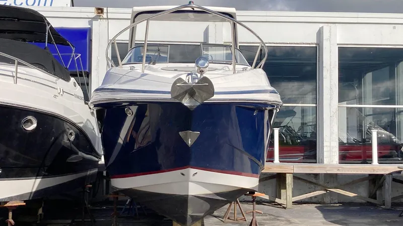 Slide: The Image of 2016 Regal 28 Express boat docked at marina, front view. - 1