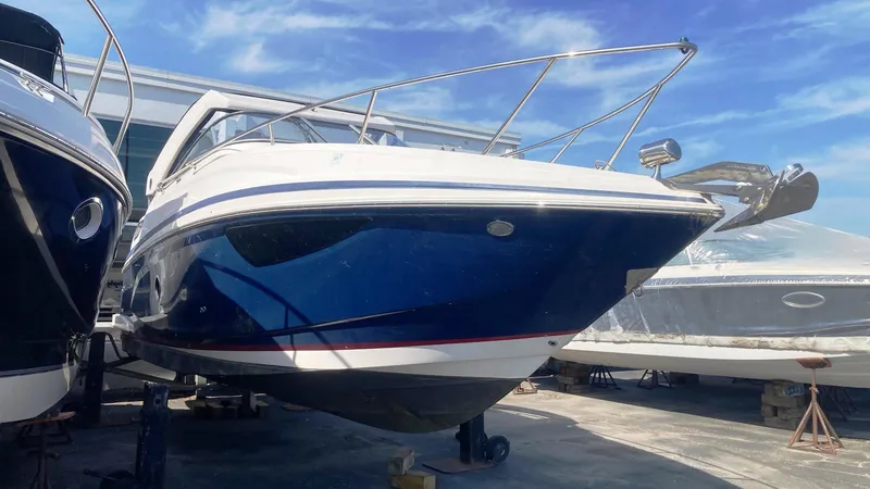 Slide: The Image of 2016 Regal 28 Express boat on display under a clear blue sky. - 2