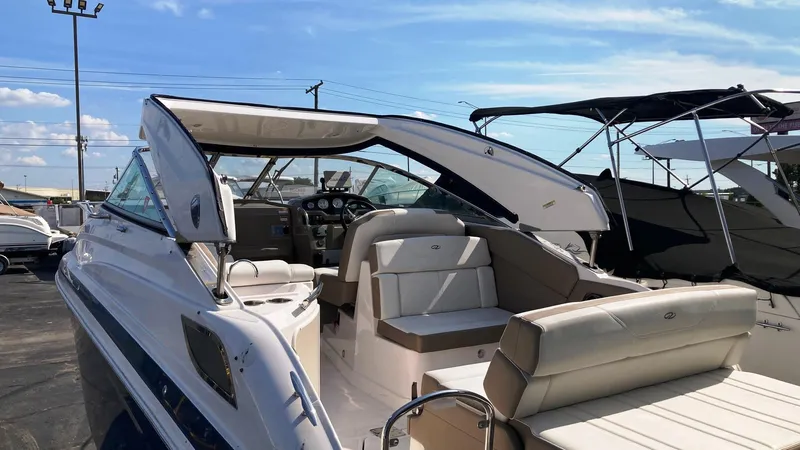 Slide: The Image of 2016 Regal 28 Express boat with open cockpit and seating, displayed outdoors. - 5