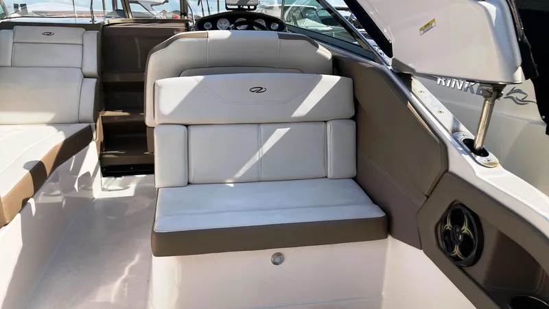 Slide: The Image of 2016 Regal 28 Express boat interior with white seating and dashboard view. - 8