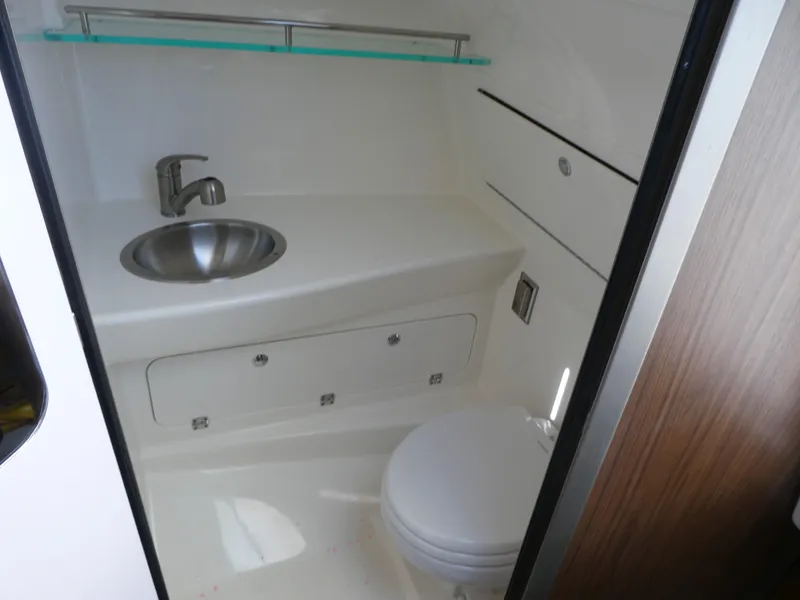 Slide: The Image of 2024 Boston Whaler 285 Conquest bathroom with sink and toilet. - 15