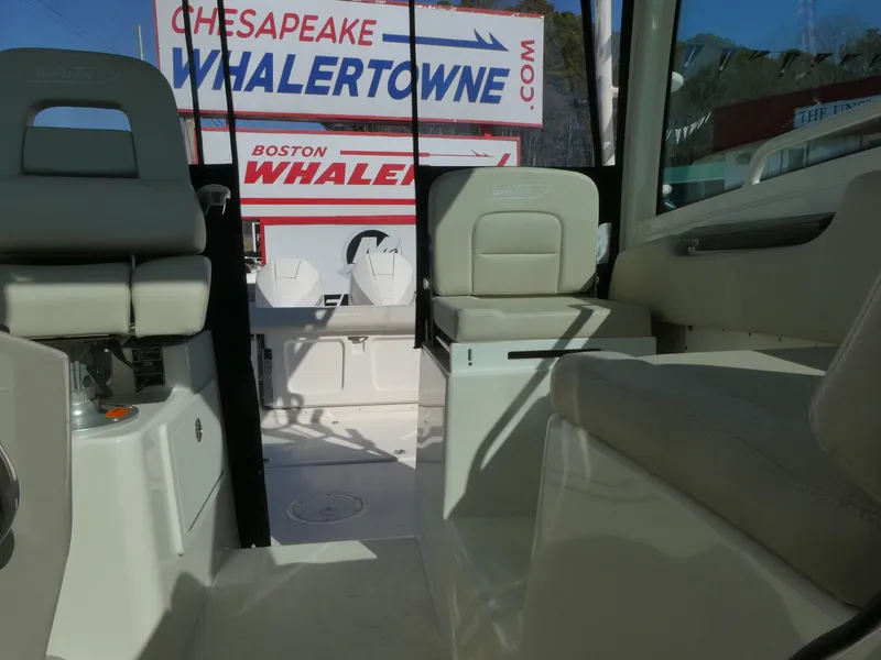 Slide: The Image of 2024 Boston Whaler 285 Conquest interior with seating, showcased at Chesapeake Whalertowne. - 9