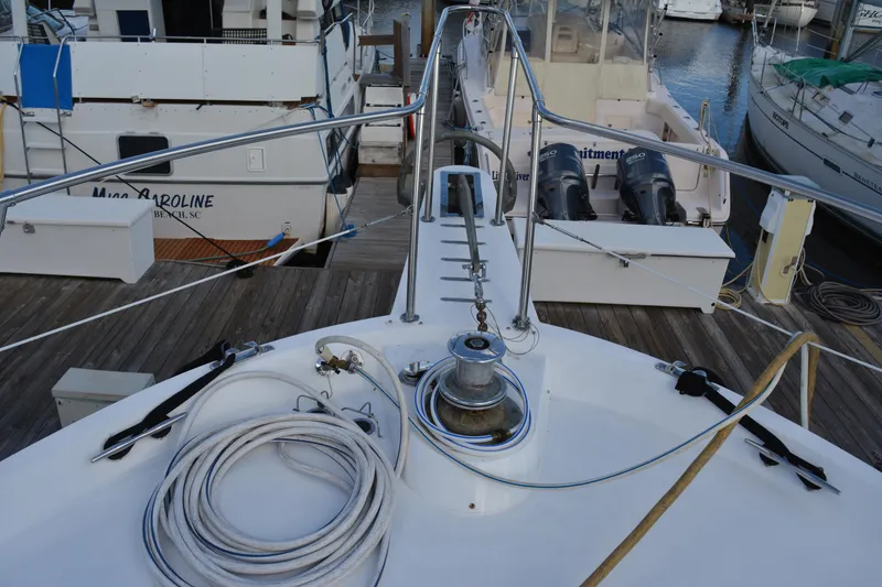 Slide: The Image of 1989 Viking Motor Yacht docked, featuring deck equipment and marina view. - 19
