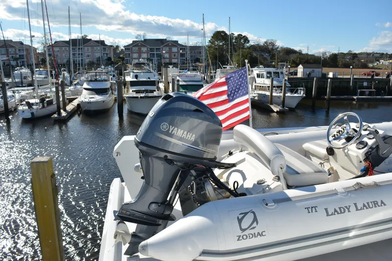 Slide: The Image of 1989 Viking Motor Yacht docked with Yamaha engine and American flag. - 33