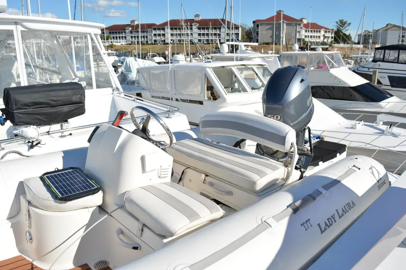 Slide: The Image of 1989 Viking Motor Yacht docked at marina with inflatable tender boat. - 36