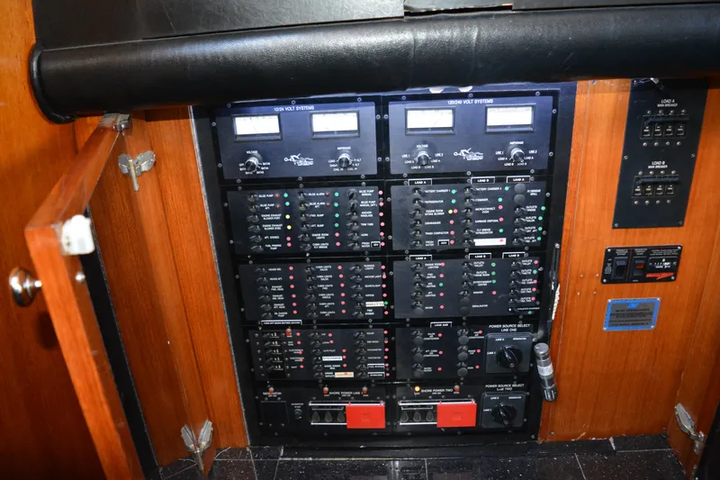 Slide: The Image of Electrical panel of a 1989 Viking Motor Yacht, featuring various switches and meters. - 45