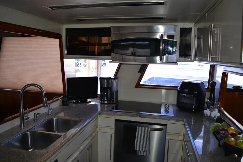 Slide: The Image of Modern kitchen interior of 1989 Viking Motor Yacht with stainless steel appliances. - 46