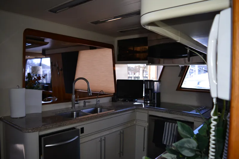 Slide: The Image of Interior of 1989 Viking Motor Yacht kitchen with modern appliances and sleek design. - 47