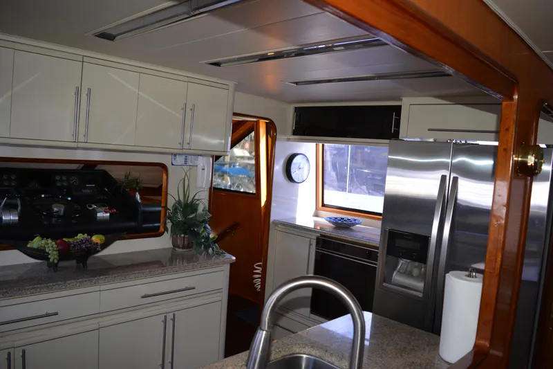 Slide: The Image of Interior of 1989 Viking Motor Yacht kitchen with modern appliances and sleek cabinetry. - 48