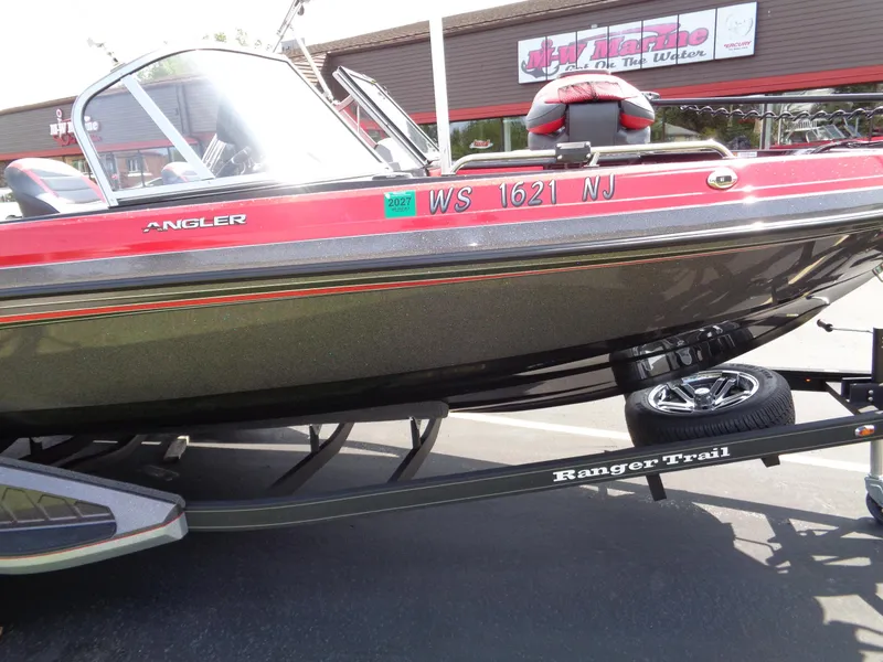 Slide: The Image of 2023 Ranger 2080MS A Pack boat on trailer, red and black design. - 15