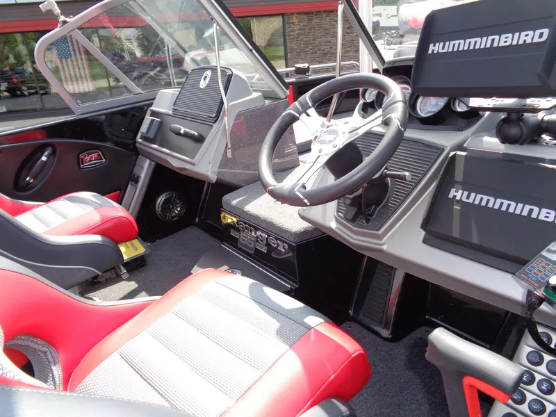 Slide: The Image of 2023 Ranger 2080MS A Pack boat interior with red seats and Humminbird electronics. - 18