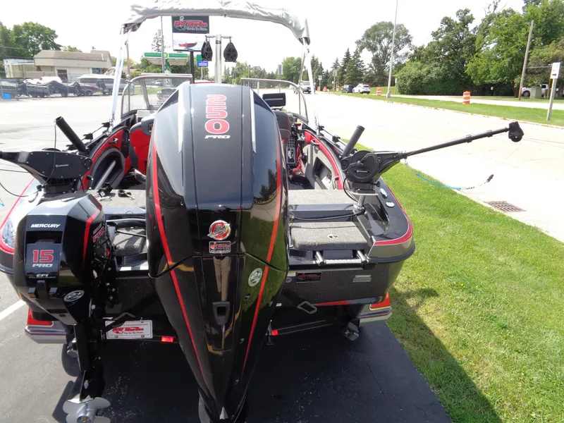 Slide: The Image of 2023 Ranger 2080MS A Pack boat with Mercury outboard engines, parked on a sunny day. - 22
