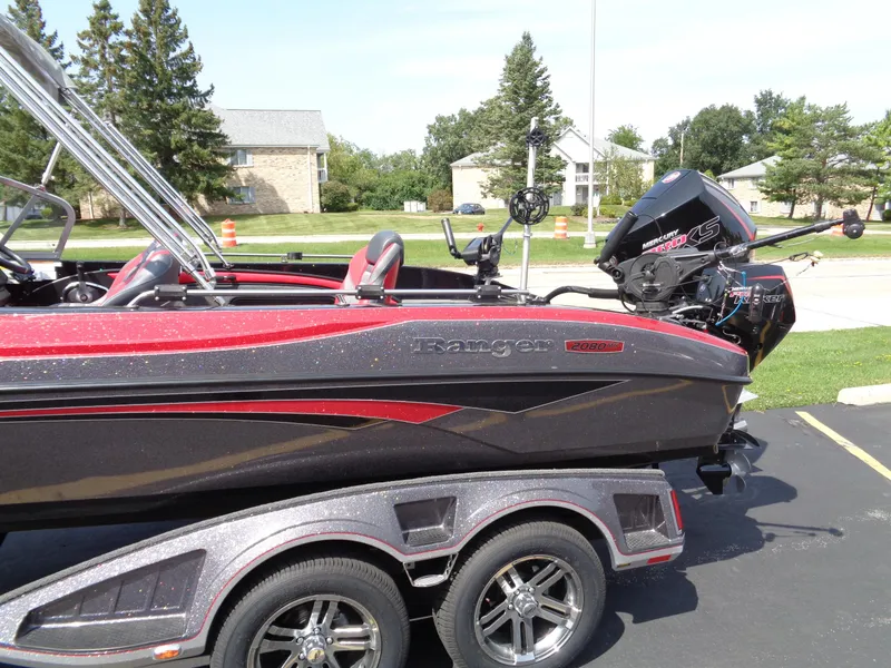 Slide: The Image of 2023 Ranger 2080MS A Pack boat on trailer, parked outdoors. - 4