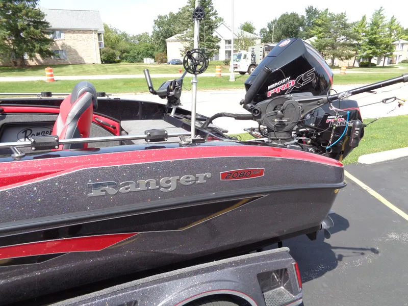 Slide: The Image of 2023 Ranger 2080MS A Pack boat with Mercury engine, parked outdoors. - 5