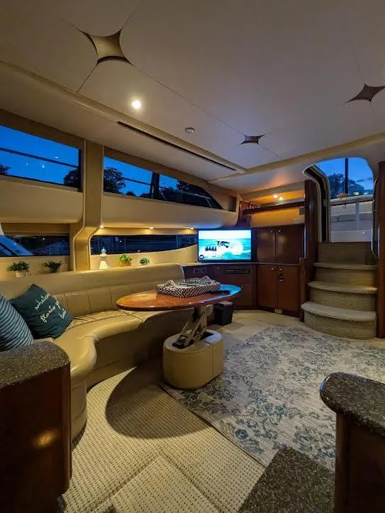 Slide: The Image of Luxurious interior of a 2005 Meridian 459 Motoryacht with elegant seating and ambient lighting. - 13