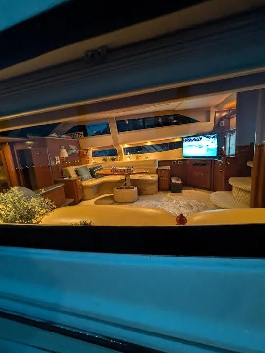 Slide: The Image of Luxurious interior of a 2005 Meridian 459 Motoryacht, featuring cozy seating and ambient lighting. - 15
